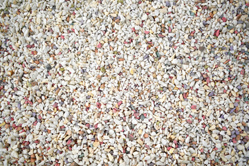 Beautiful multicolored pebbles in bulk. Top view