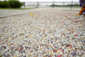Beautiful multicolored pebbles in bulk. Selective focus. Copy space