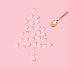 Christmas creative layout with sugar cubes forming Christmas tree and golden teaspoon on pastel...