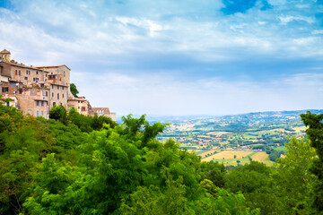 Fototapeta na wymiar Medieval town Todi on the hill Italy, tourist tourism. Ancient cities of Europe, beautiful landscape panoramic view. Fortifications of medieval Italy.