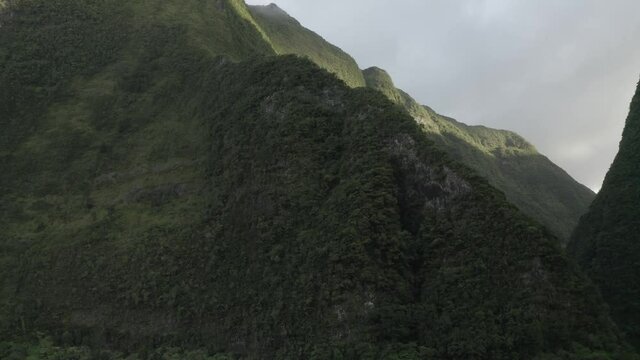 Aerial view of a waterfall (La Cascade Blanche) among the mountain landscape near Saint Andr&egrave;, Saint Benoit, Reunion.