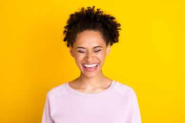 Photo of young happy dark skin woman smile enjoy laughter good mood isolated on yellow color background