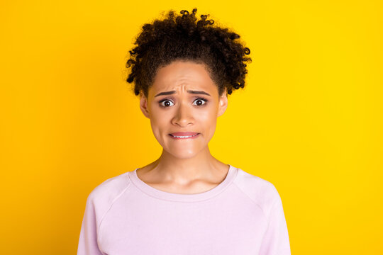 Portrait of horrified dark skin people biting lip look camera panic isolated on bright color background