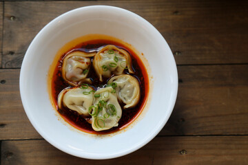 Traditional Asian dumplings with soy sauce