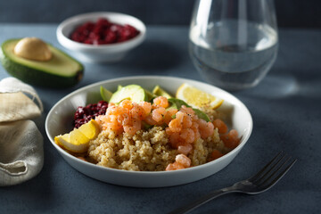 Healthy quinoa bowl with shrimps and avocado