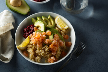 Healthy quinoa bowl with shrimps and avocado