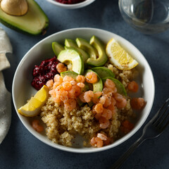 Healthy quinoa bowl with shrimps and avocado
