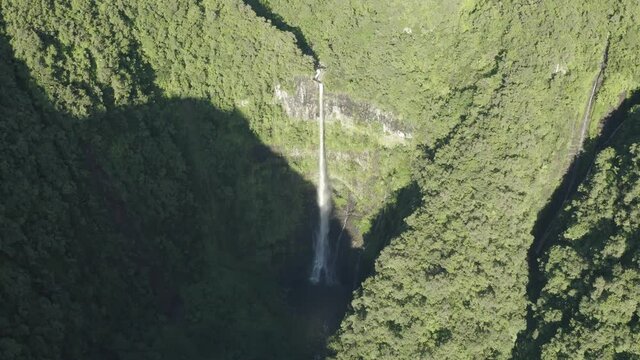 Aerial view of Cascade de La Grande Ravine, a beautiful waterfall among the wild mountains near Saint Benoit, Reunion.