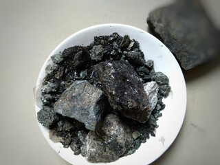 Shilajit is a sticky substance found primarily in the rocks of the Himalayas. It develops over centuries from the slow decomposition of plants. Shilajit is commonly used in ayurvedic medicine.  