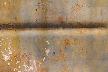 Old and rusty military armored vehicle metal surface.