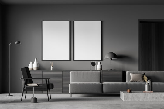Two empty canvases in minimalist dark grey living room
