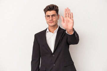 Young business caucasian man isolated on white background standing with outstretched hand showing...