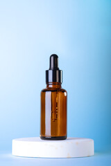 Amber glass dropper cosmetic bottles, white podium on pastel blue background. Scene with geometric shapes. Showcase.