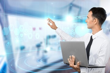 Male Engineer Confident and Focused Thinking, working on Laptop pc