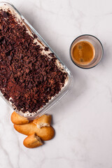 Top view of gourmet Tiramisu italian with a cup of coffee with copy space. Classic italian recipe.