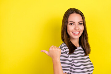 Profile photo of good millennial brunette lady point empty space wear striped t-shirt isolated on...