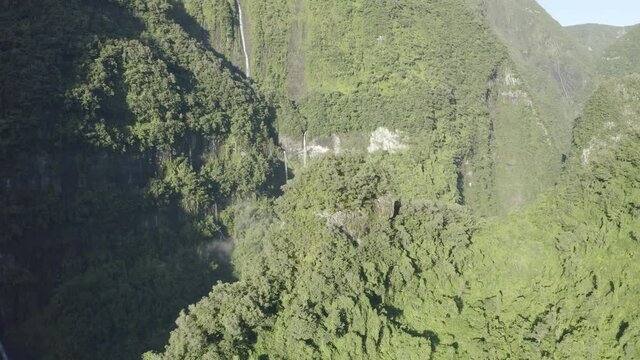 Aerial view of Cascade de La Grande Ravine, a beautiful waterfall among the wild mountains near Saint Benoit, Reunion.
