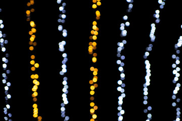 Christmas bokeh overlay background. colored garland light on the black background. New Year, festive