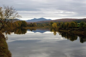 Early morning sunrise over the Missisquoi River and Jay Peak in Vermont