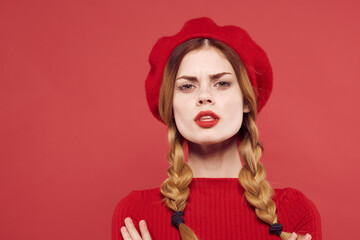 pretty woman with a red cap on his head glamor isolated background