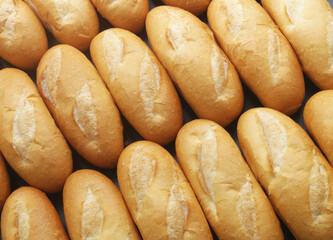 Fresh white bread buns background