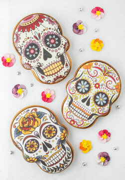 abstract background with gingerbread in the form of painted skulls for day of the dead or halloween