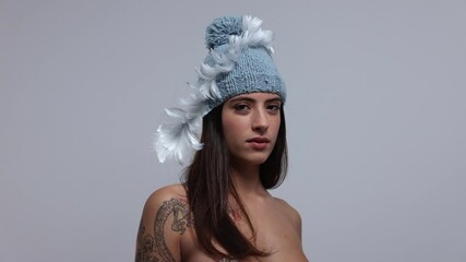 Woman posing and dancing in knitwear hat