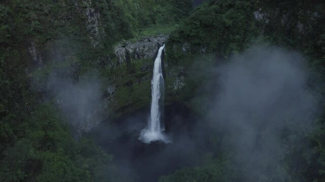 Aerial view of Cascade de La Grande Ravine, a beautiful waterfall among the wild mountains near Saint Benoit, Reunion.