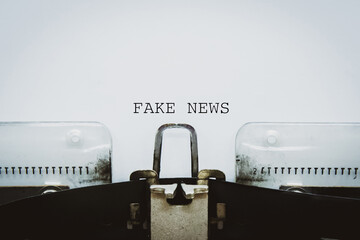 "Fake News" words typed on a vintage typewriter.