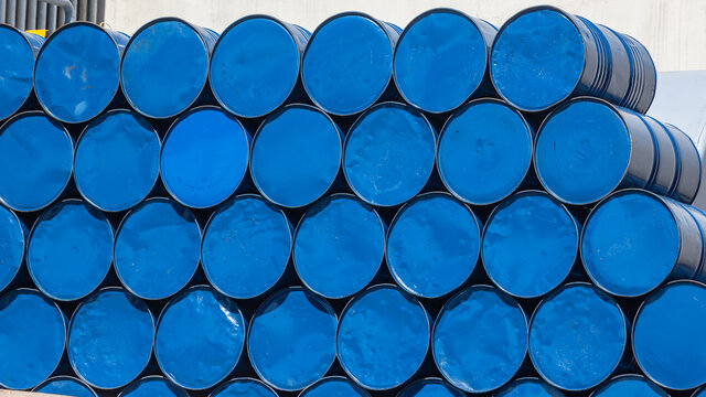 Steel Blue Container Oil Chemical Drums Stacked outdoors