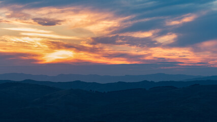 Fototapeta na wymiar the curved hills seen to the sunset