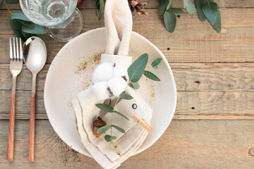 Autumn table decor. Table setting with eucalyptus branches, pumpkins