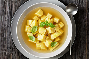 soup of chicken broth with parmesan egg dumplings