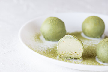 Truffles with matches and limes on a white plate. Sugar, gluten and lactose free and vegan.