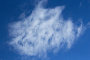 Blue sky background with white clouds around. autumn day
