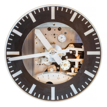 Twentieth century clock face with visible innerworks isolated on white