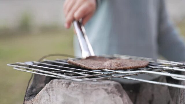 Grilling sticky rice with black sesame over charcoal stove as Traditional Northern Thai food