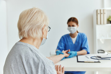 Fototapeta premium nurse and patient patient examination medical office