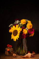 Classic still life with a bouquet of autumn flowers