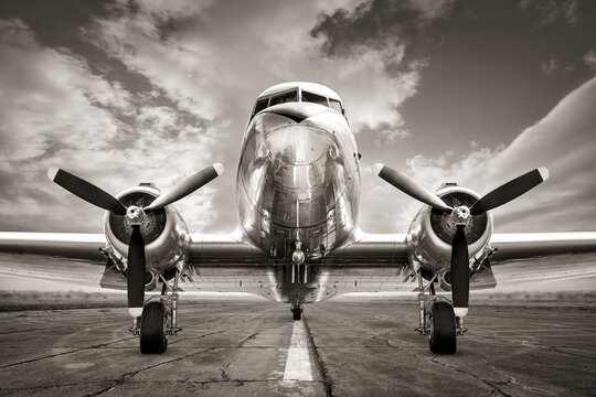 historical aircraft on a runway ready for take off - Powered by Adobe