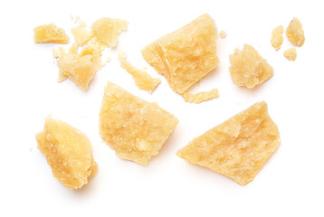 Pieces of parmesan cheese isolated on white background. Pattern. Parmesan  crumbs top view. Flat lay. - obrazy, fototapety, plakaty