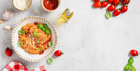Tasty appetizing classic italian spaghetti pasta with tomato sauce, parmesan cheese and fresh basil...
