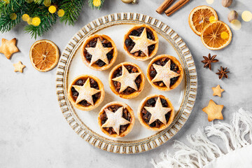 Traditional British Christmas pastry Mince Pies with apple, raisins, nuts filling. Top view