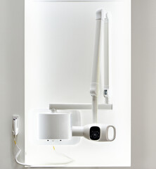 Wall-mounted x-ray dental machine