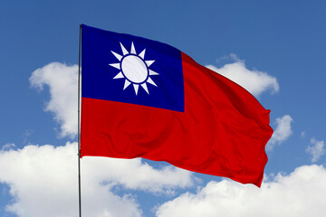 Taiwan flag isolated on the blue sky background. close up waving flag of Taiwan. flag symbols of Taiwan. Concept of Taiwan.