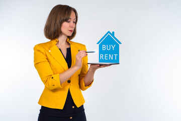 Fototapeta na wymiar Real estate agent woman on a white background. Buying and selling real estate. real estate agent woman with a tablet in her hands. Businesswoman chooses house. Concept - apps for selection of home.