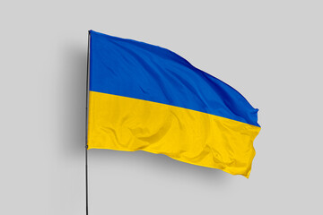 Ukraine flag isolated on the blue sky background. close up waving flag of Ukraine. flag symbols of Ukraine. Concept of Ukraine.