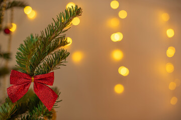 Christmas and New Year background. Close-up Xmas tree with decorations on abstract background with copy space. Greeting or invitation card. Holiday concept