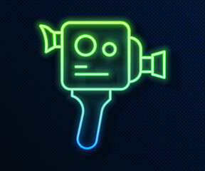 Glowing neon line Retro cinema camera icon isolated on blue background. Video camera. Movie sign. Film projector. Vector