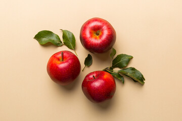 Many red apples on colored background, top view. Autumn pattern with fresh apple above view with copy space for design or text